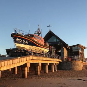 RNLI boat outside station on Exmouth Beach